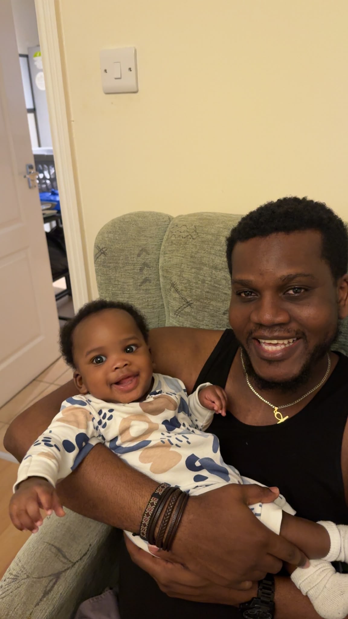 Dad smiling with his baby