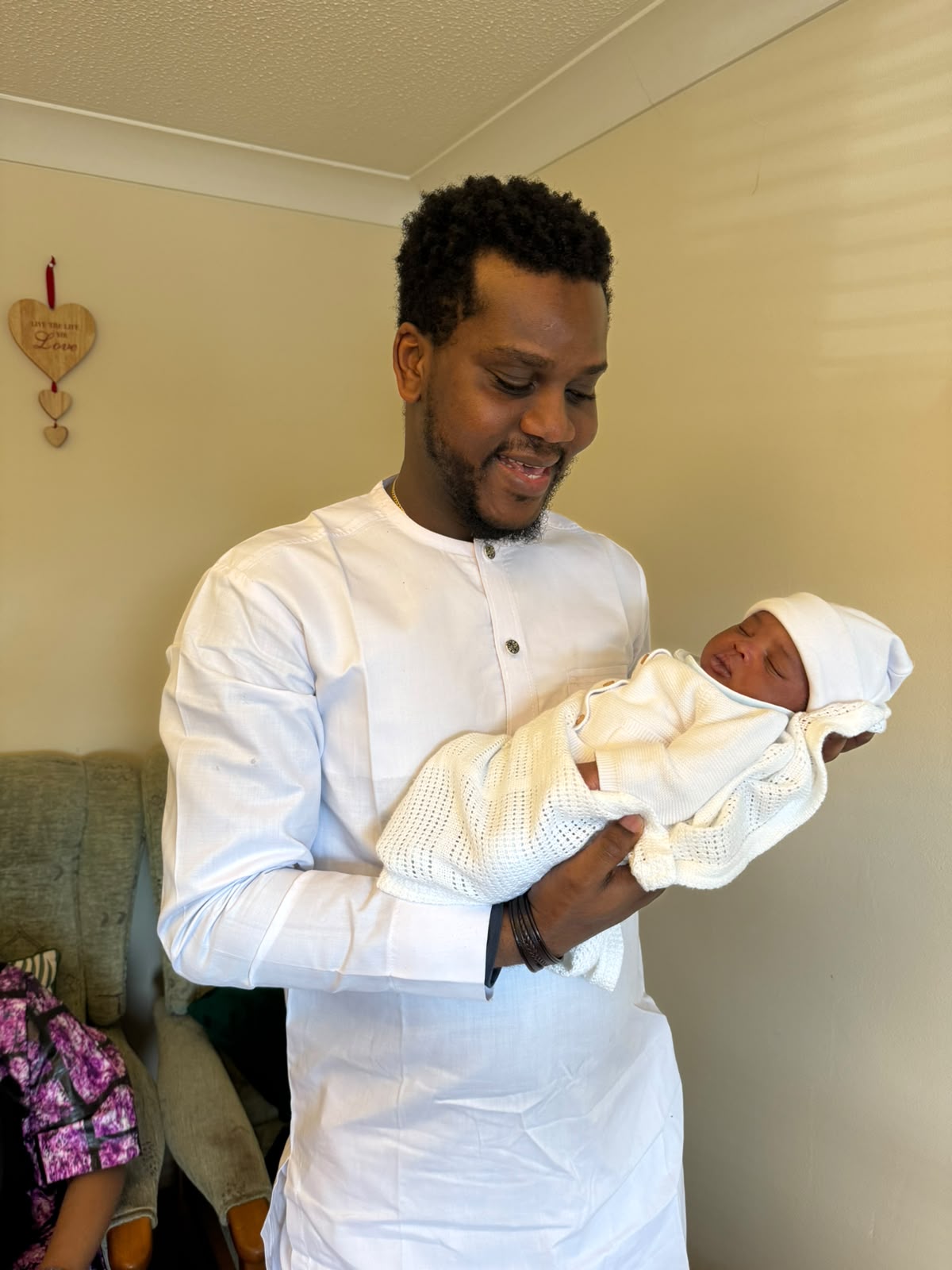 Dad holding his newborn baby
